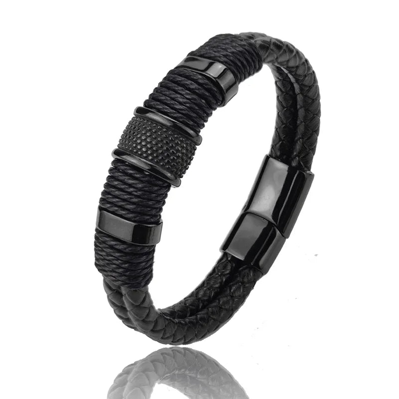 Black braided bracelet with metallic clasp on a white background