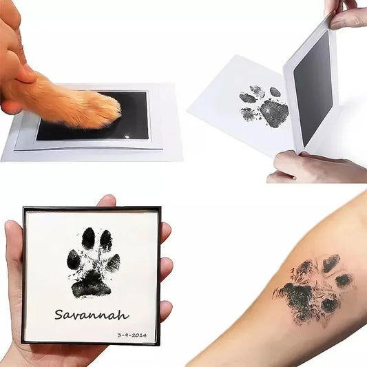 Pet paw print kit with paw prints on paper and tattoo, held by hands.
