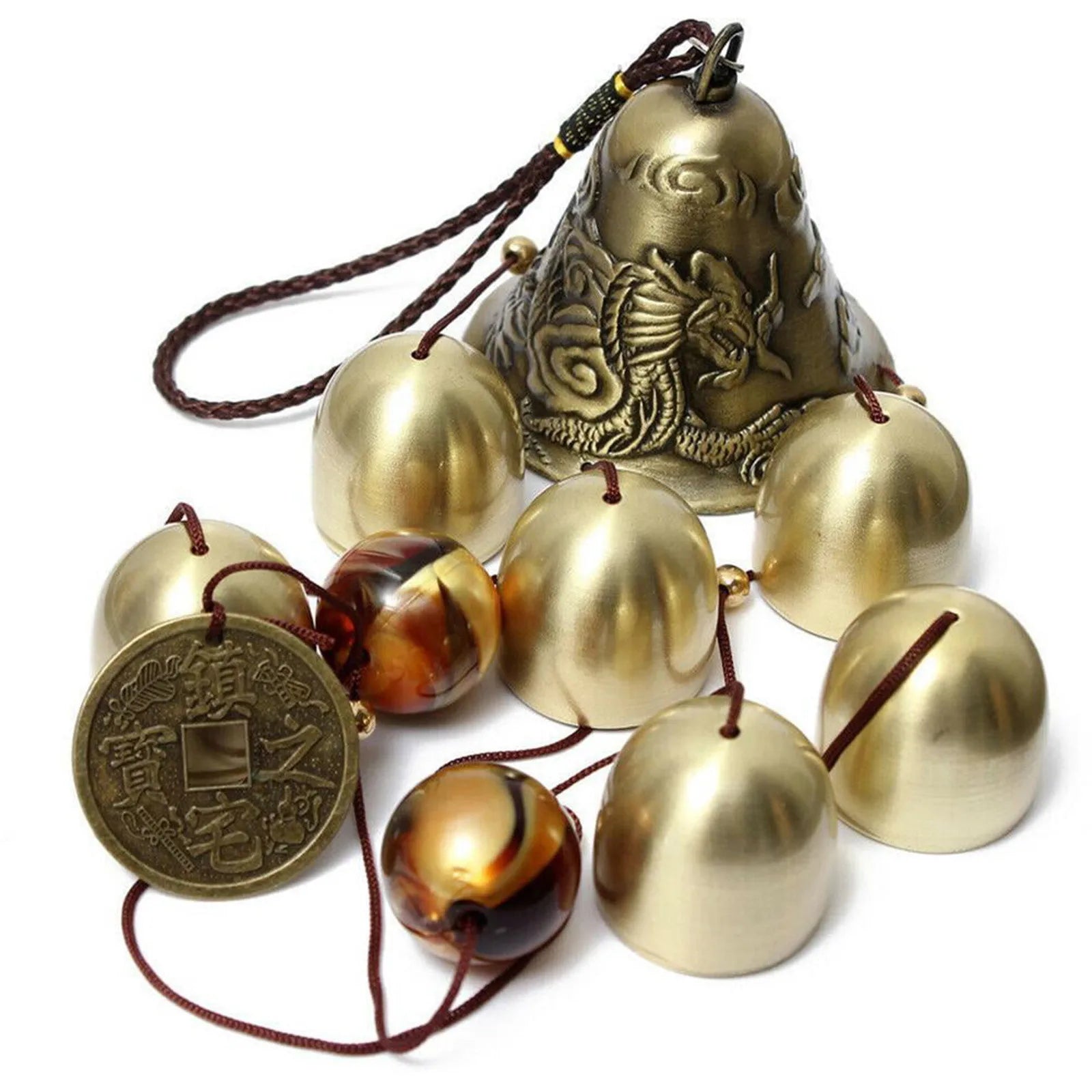 Decorative bell with gold bells and a coin on a white background which is part of the windchime