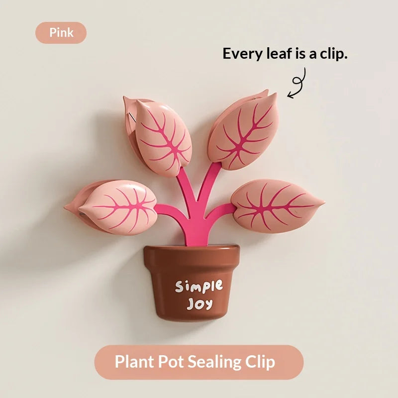 Pink plant pot sealing clip with leaf-shaped clips on a light gray background