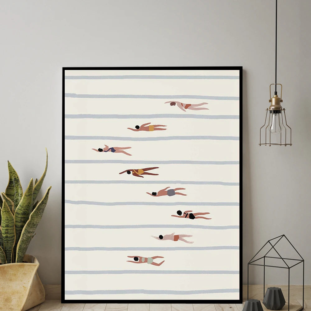 Framed artwork with swimmer illustrations on a striped background, hanging on a wall.