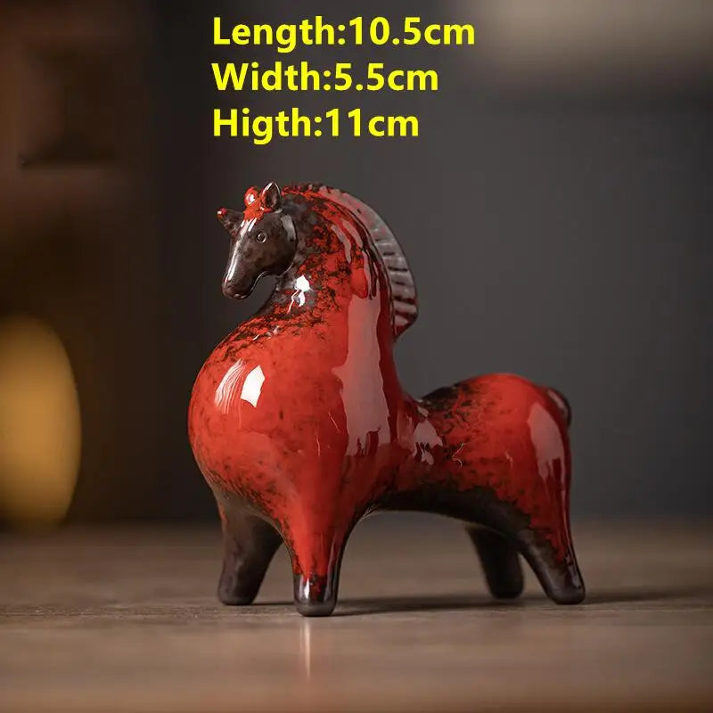 Red ceramic horse figurine with dimensions displayed on a dark background
