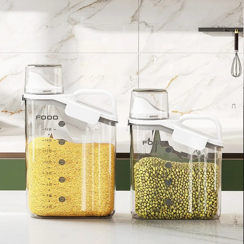 Two glass containers with white lids on a kitchen counter, filled with yellow and green grains.