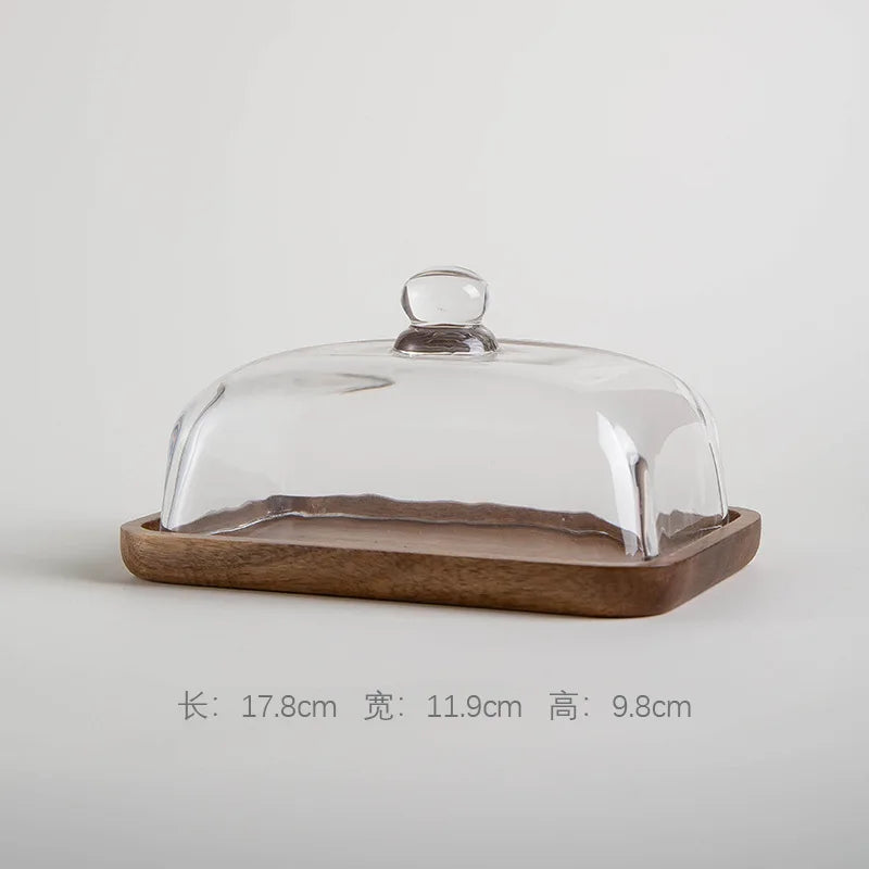 Glass pastry display dome with bamboo serving base