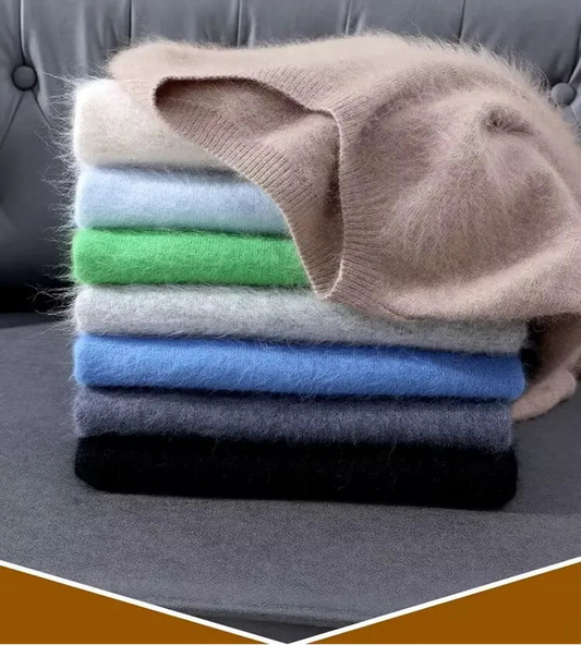 Stack of folded clothes on a gray surface with text overlay