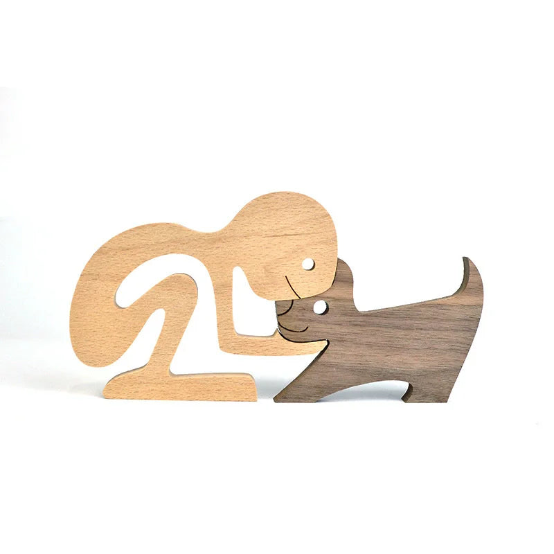 Wooden figurines of a woman and a dog on a white background