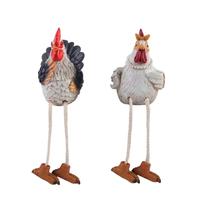 Two decorative rooster figures with long legs on a white background