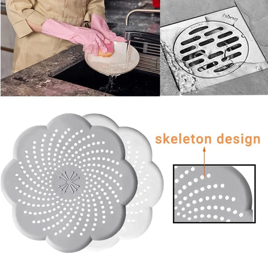 Gray silicone strainer with skeleton design, used for kitchen sink and shower drain.