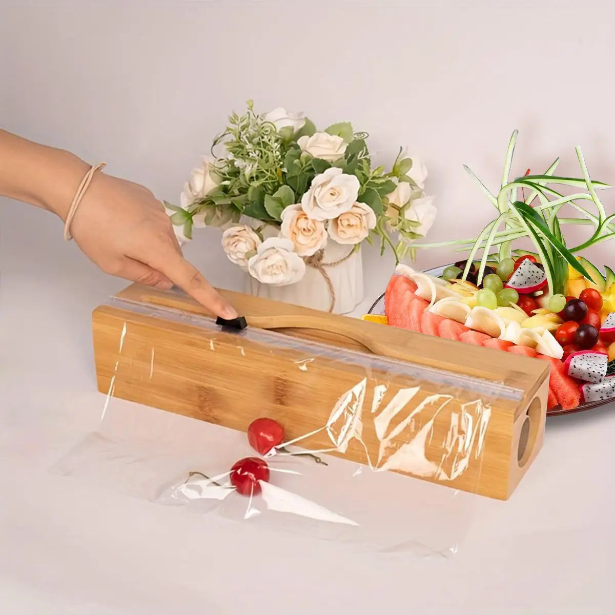 Bamboo kitchen wrap dispenser with integrated foil and cling film cutter