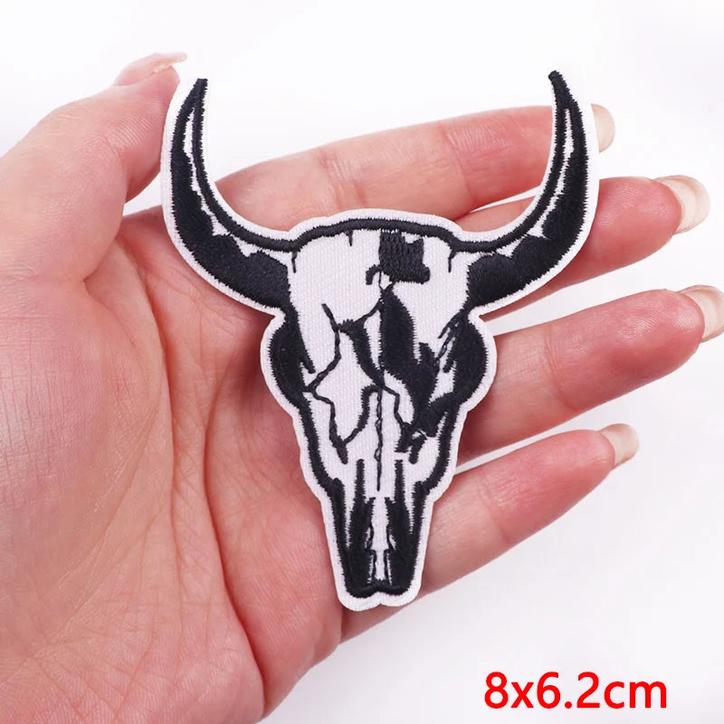 Bull skull patch held in a hand with dimensions displayed