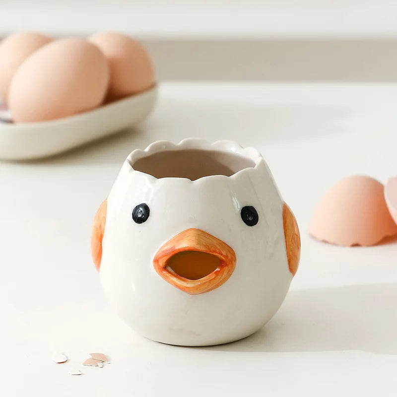 Ceramic duck-shaped egg holder with eggs in the background