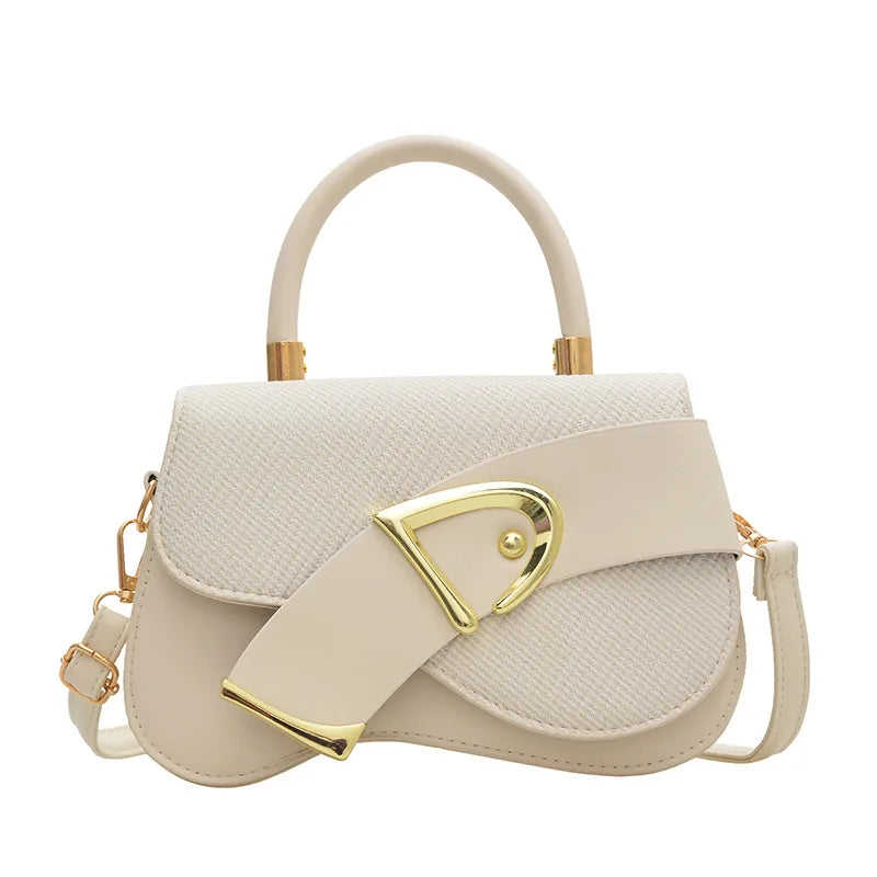 Beige handbag with gold accents on a white background