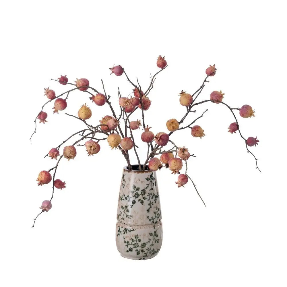 Decorative vase with floral branches on a white background