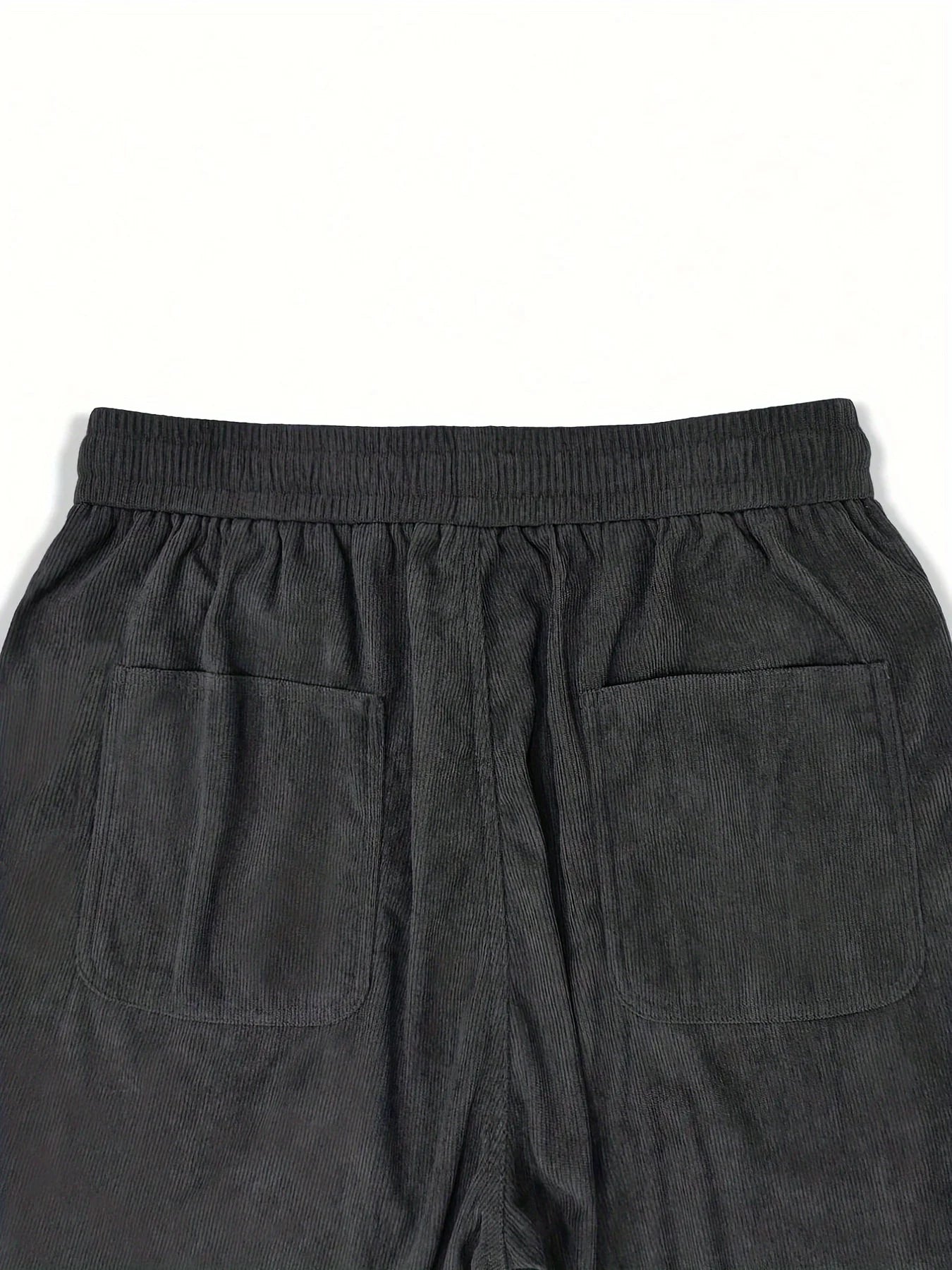 Dark gray pants with two front pockets on a white background