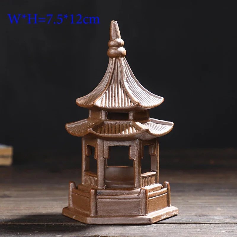 Small model of a traditional pagoda on a dark background