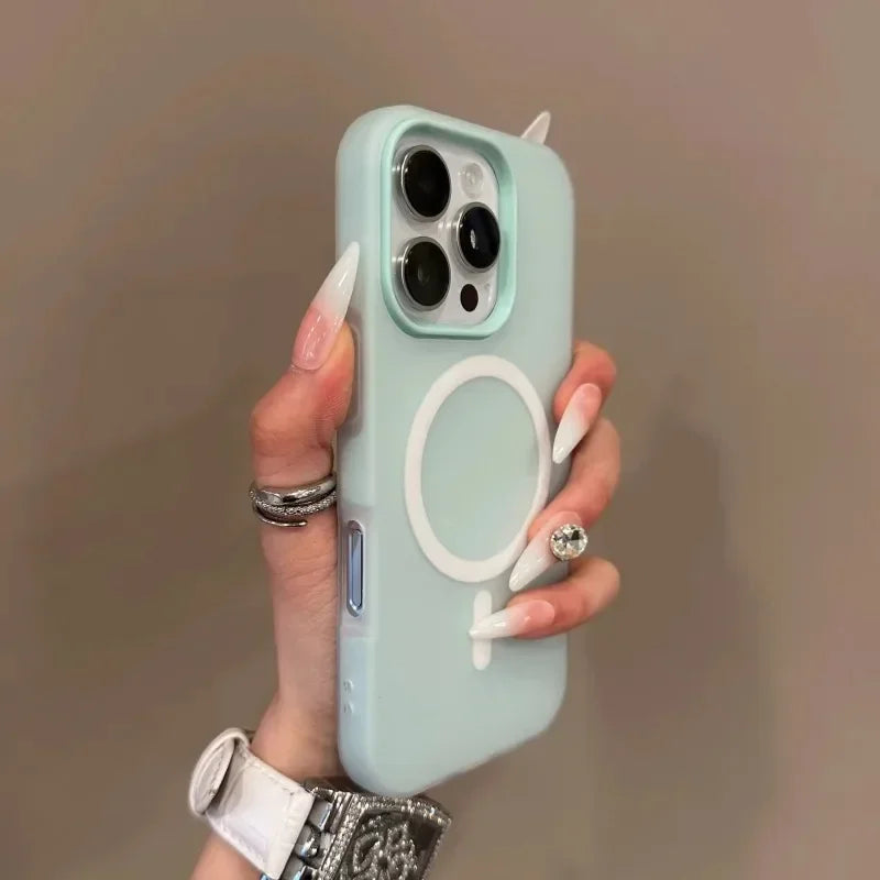 Hand holding a phone with a light blue case featuring a logo against a neutral background