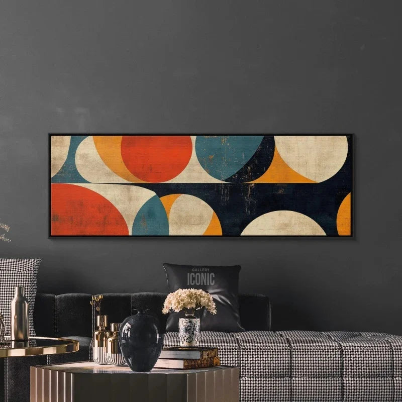 Abstract wall art above a sofa in a living room setting