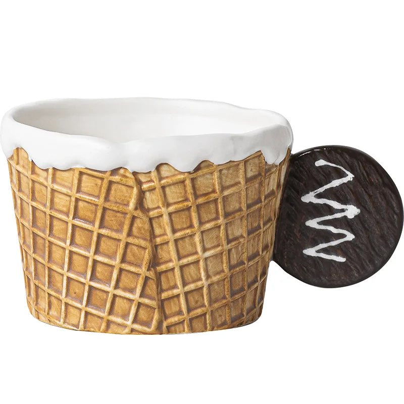 Ceramic ice cream cone bowl with a matching scoop on a white background