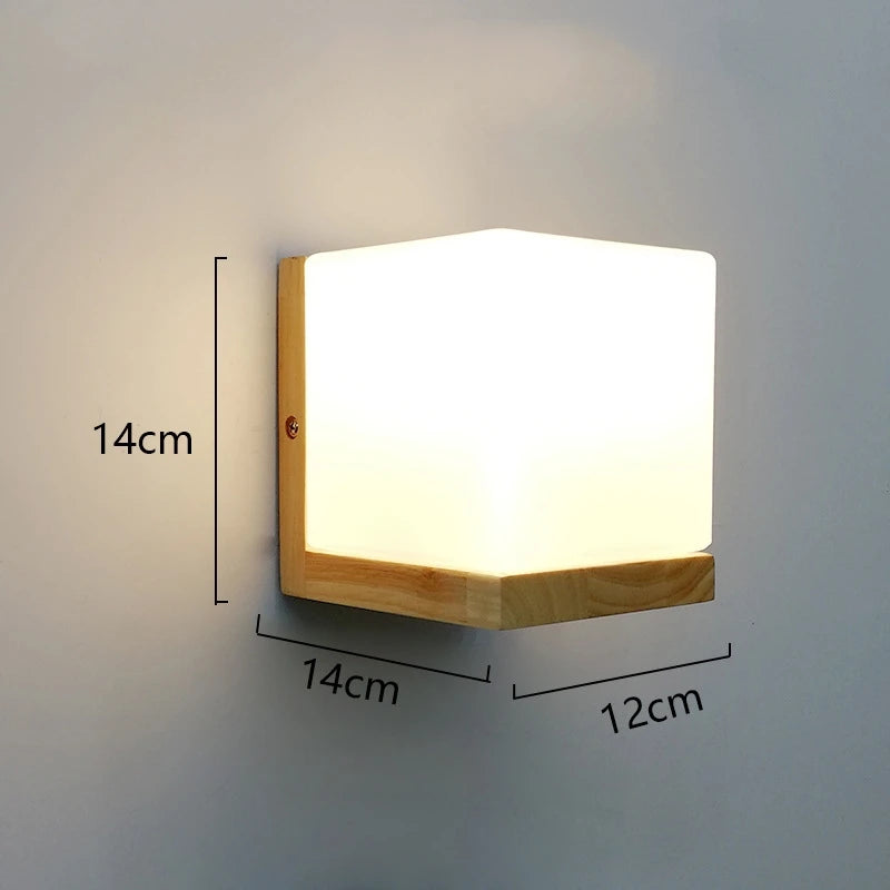 Wall-mounted light fixture with dimensions indicated on a plain wall.