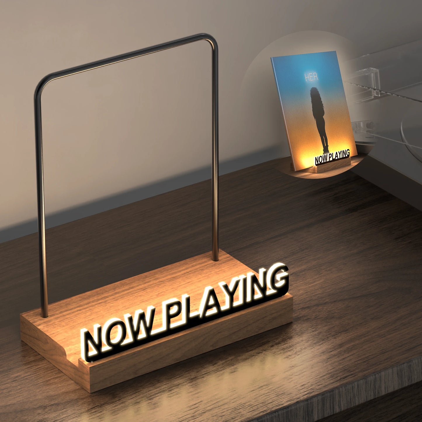 Wooden 'NOW PLAYING' sign with neon lights on a wooden surface.
