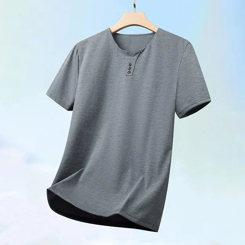 Gray t-shirt on a wooden hanger with a light blue gradient background