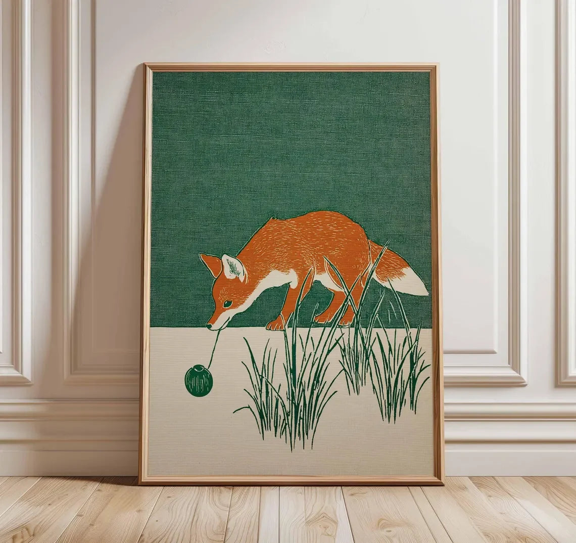 Minimalist Japanese-inspired fox art print showing an orange fox carrying a lantern through tall grass against a deep green background in a natural wood frame.