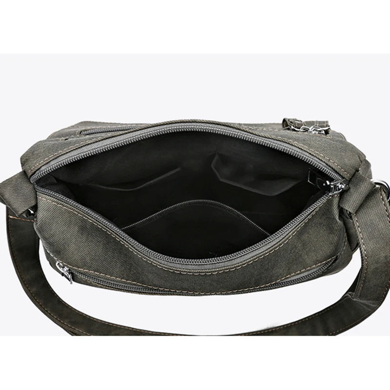 Gray shoulder bag with a visible strap on a white background