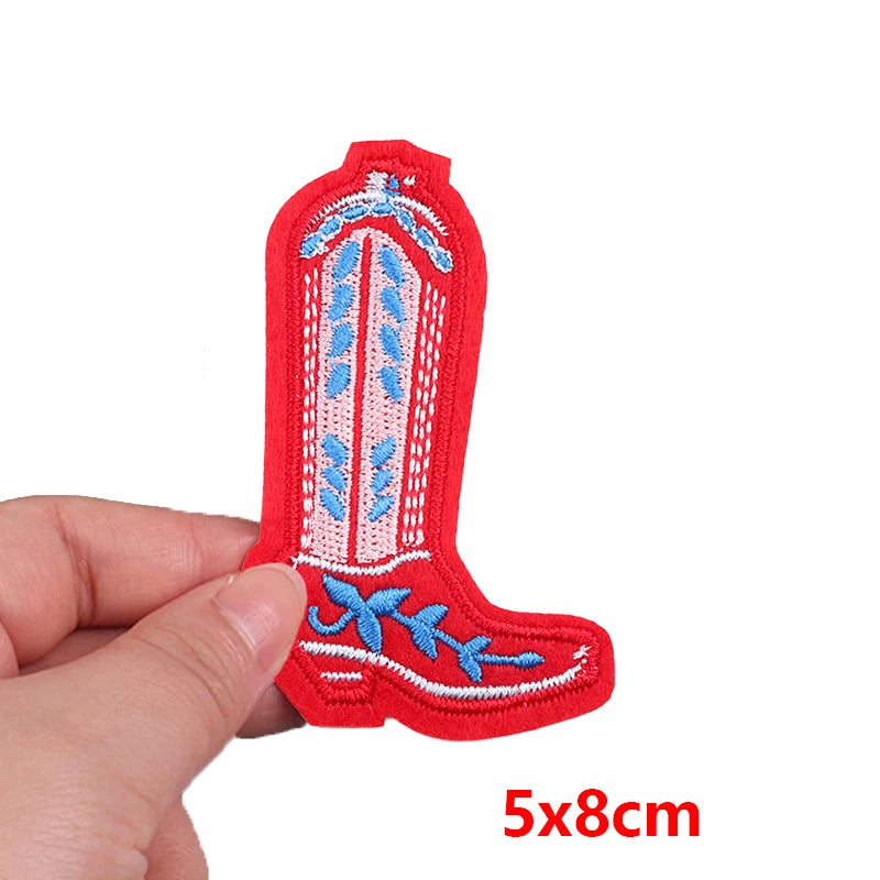 Red embroidered boot patch held by a hand with dimensions '5x8cm' displayed.