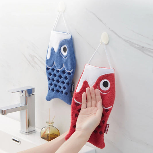 Red and blue Koi-shaped hand towels hanging on a hook in a bathroom.
