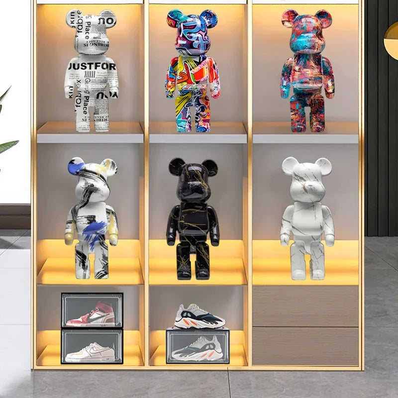 Collection of colorful bear-like figurines on a shelf with shoes below.