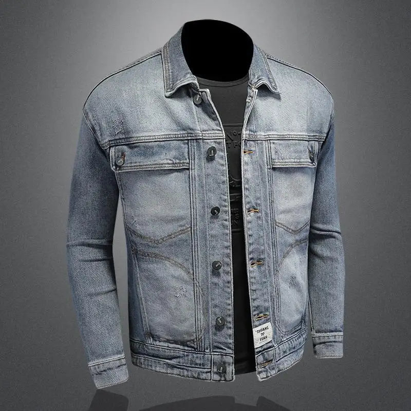 Denim jacket with a black shirt underneath on a gray background