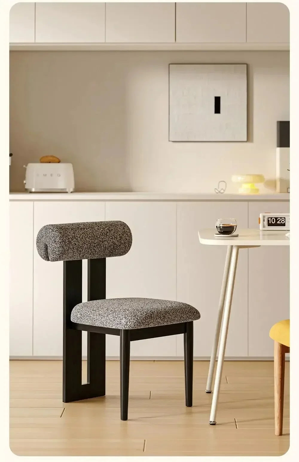 Modern chair with a textured seat and black legs in a minimalistic room.