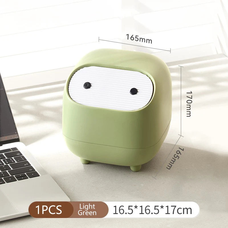 Light green cartoon-style container with dimensions on a white surface next to a laptop.