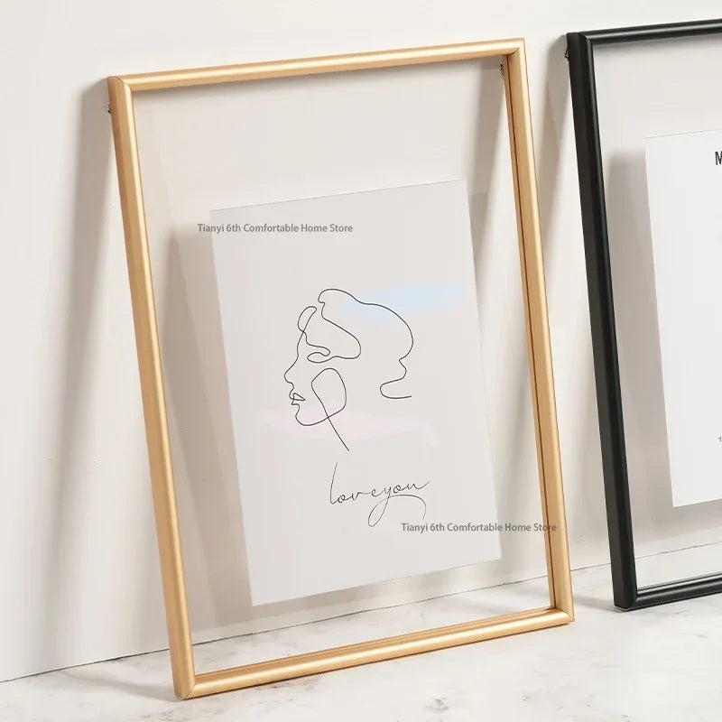 Framed minimalist line art of a face with 'love you' text on a white surface.