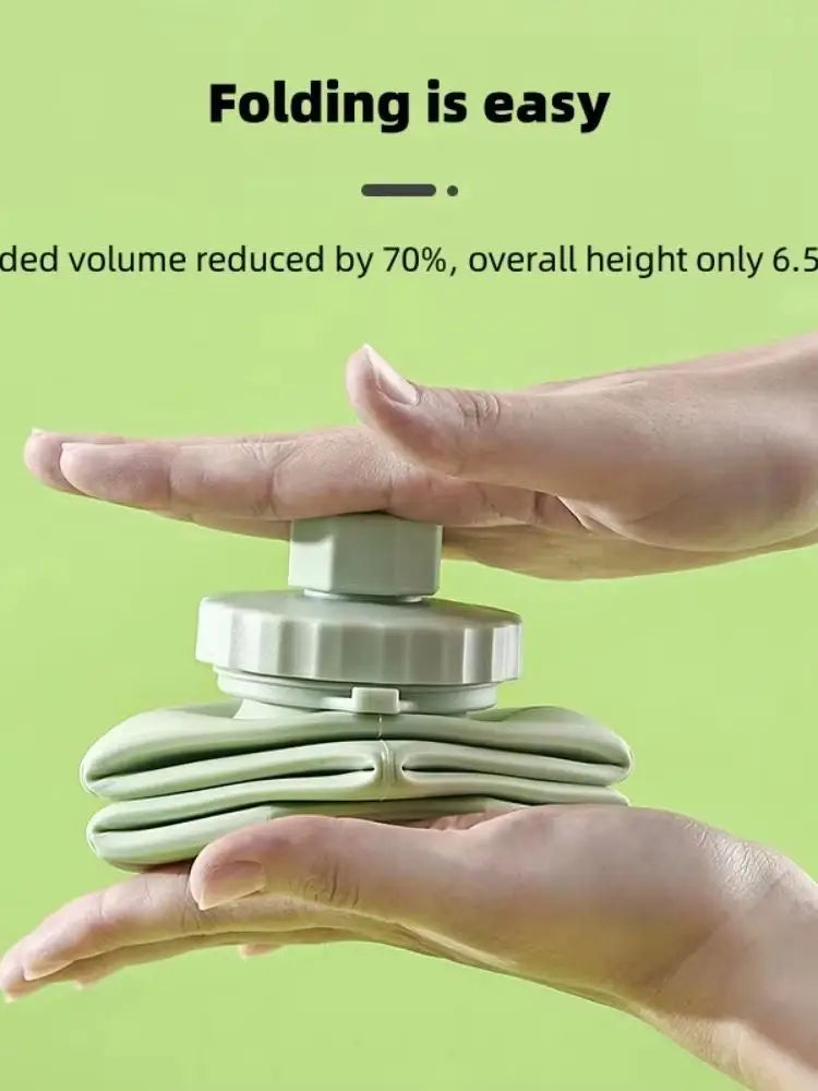 Collapsible water bottle  being folded by hands with text on a green background