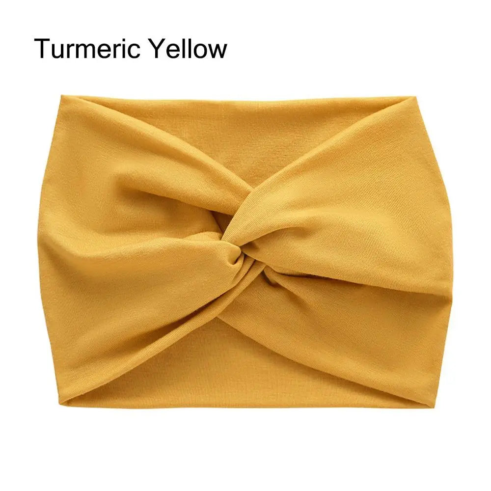 Turmeric yellow headband with a knot on a white background