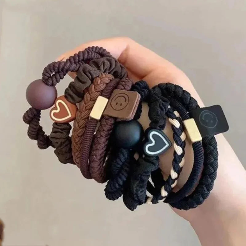 10-piece women’s elastic hair ring set in neutral colours on hand