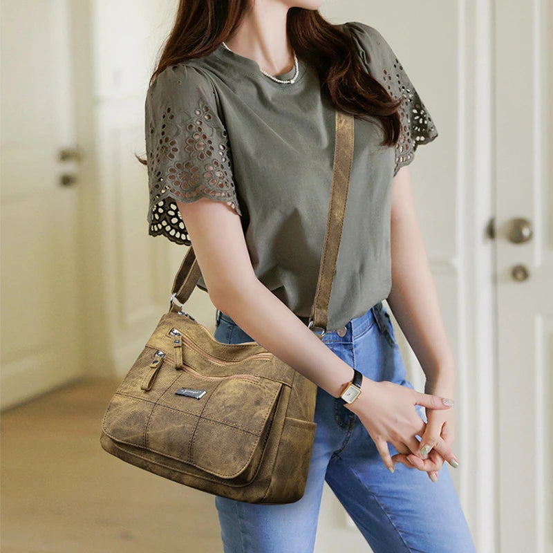 Woman holding a brown  handbag indoors
