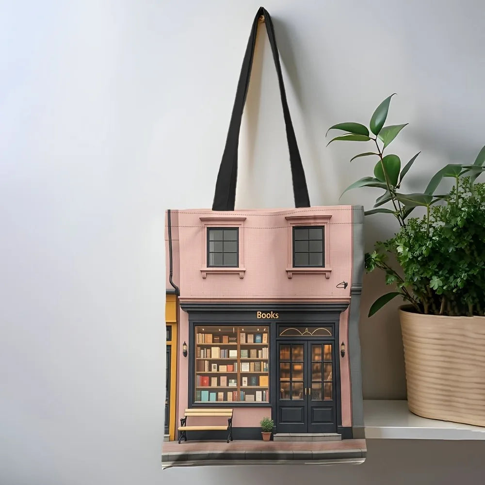 Chic bookshop print polyester tote bag featuring illustrated bookstore facade design with black shoulder straps