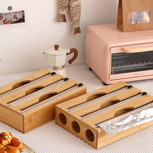 Bamboo kitchen wrap dispenser with integrated foil and cling film cutter