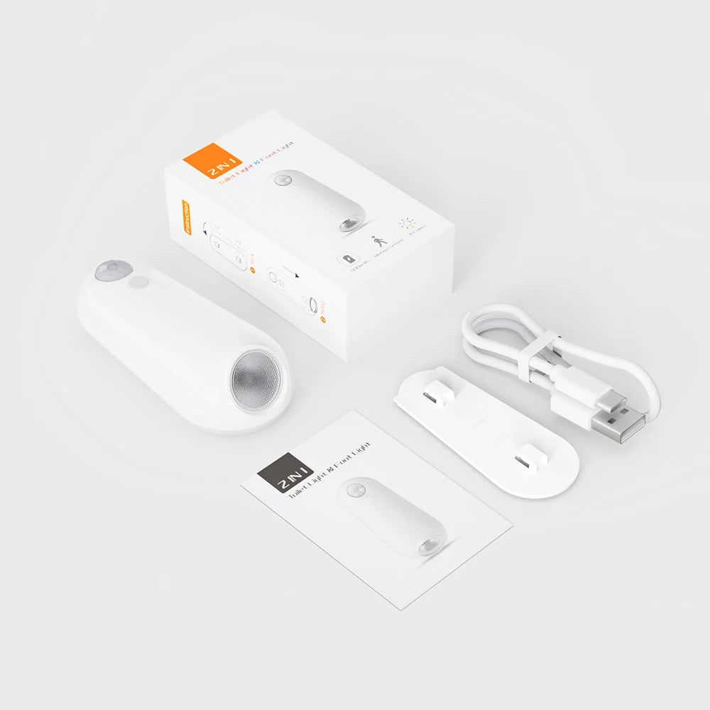 Smart home device packaging with remote control, cable, and manual on a white background