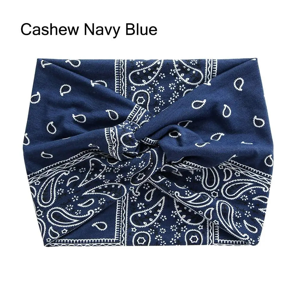 Navy blue bandana with white paisley patterns on a white background