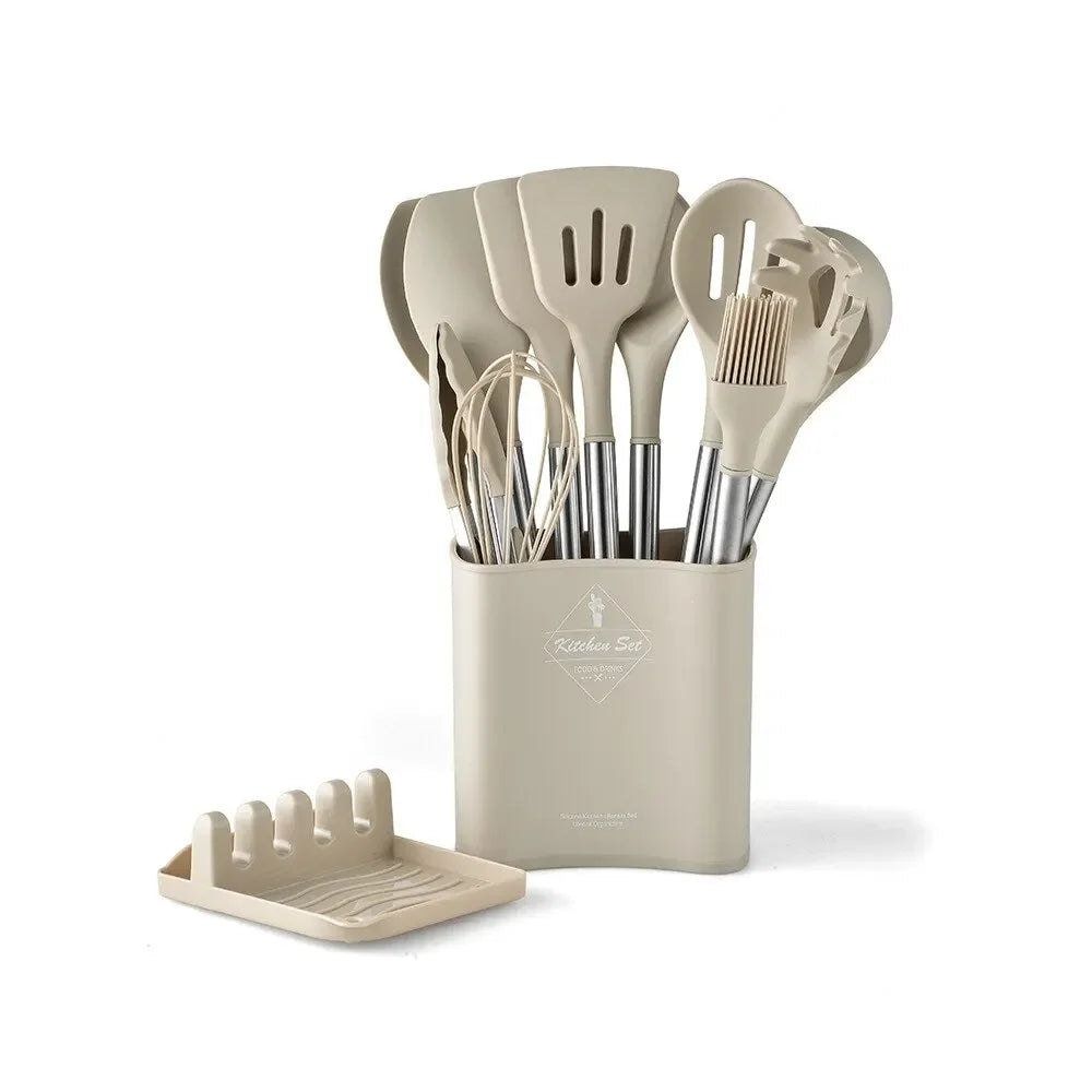 Set of kitchen utensils in a beige holder on a white background