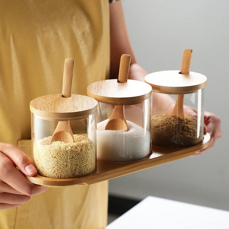 Glass spice jar set with bamboo lids and wooden tray for modern kitchen countertop organisation