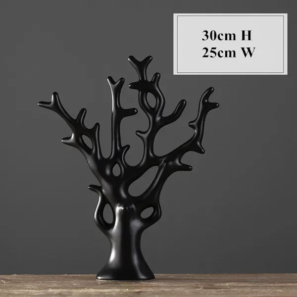 Black coral-like sculpture on a wooden surface with dimensions displayed.