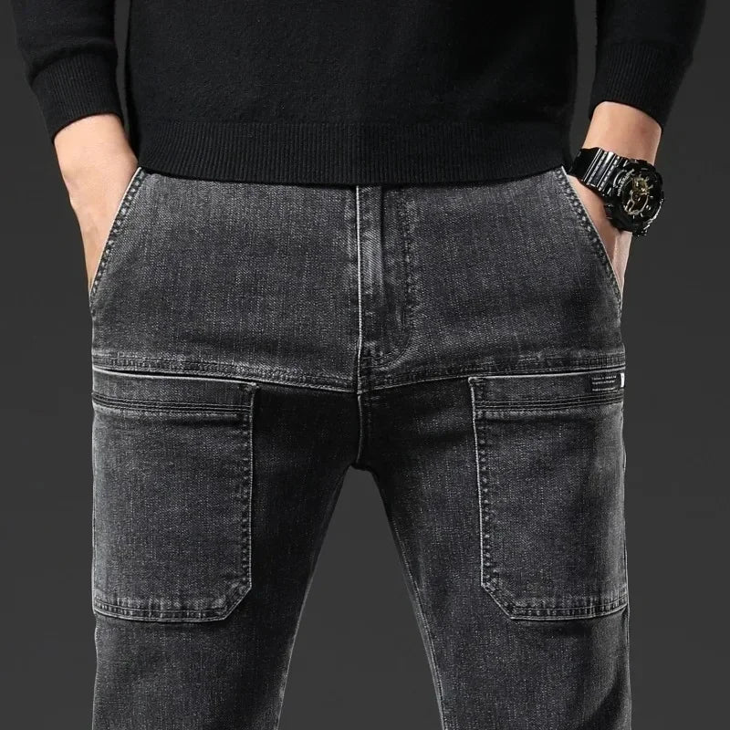 Person wearing black jeans and a black sweater on a dark background