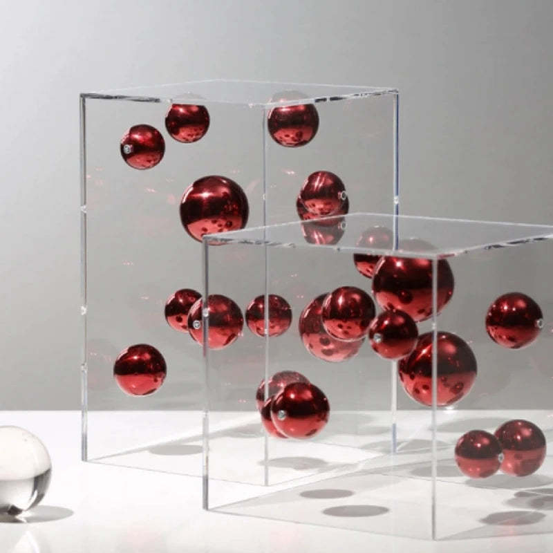 Red reflective spheres arranged inside clear acrylic cube ornaments in two sizes