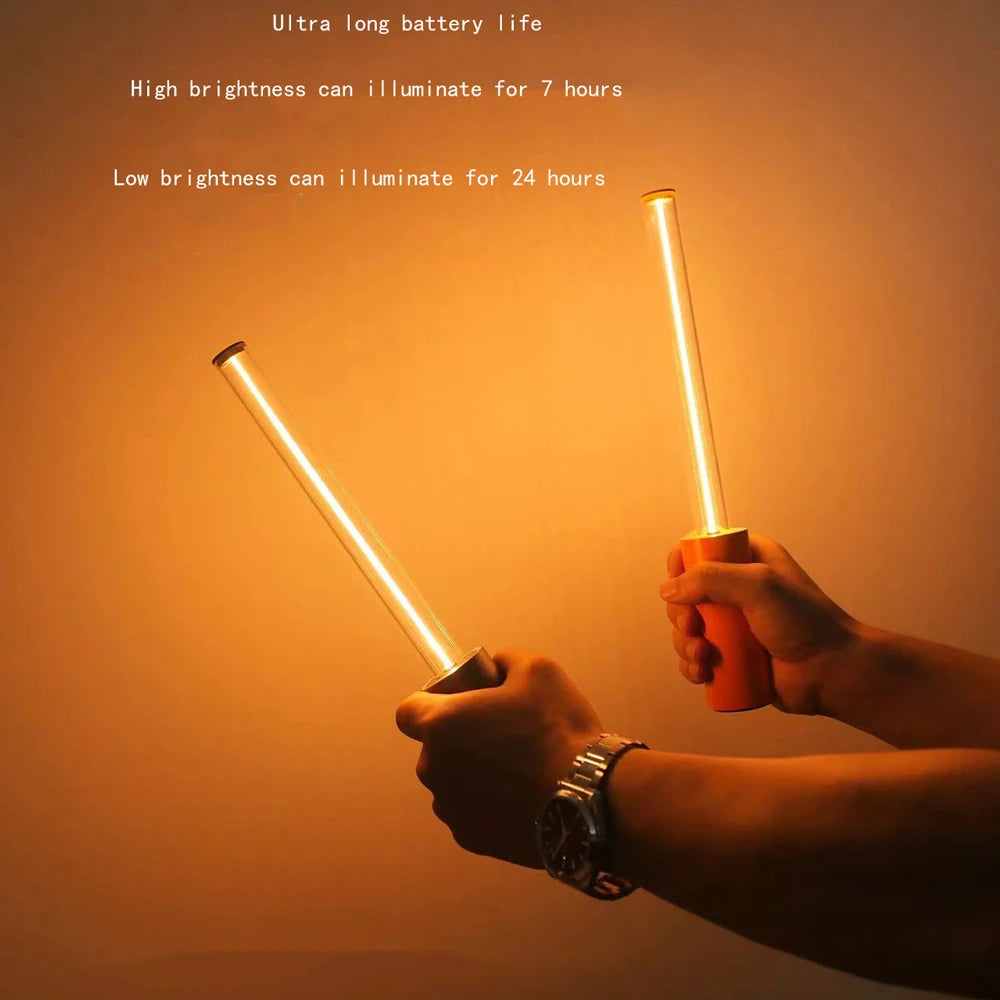 Two glowing light sticks held by hands against a warm background with text about battery life.