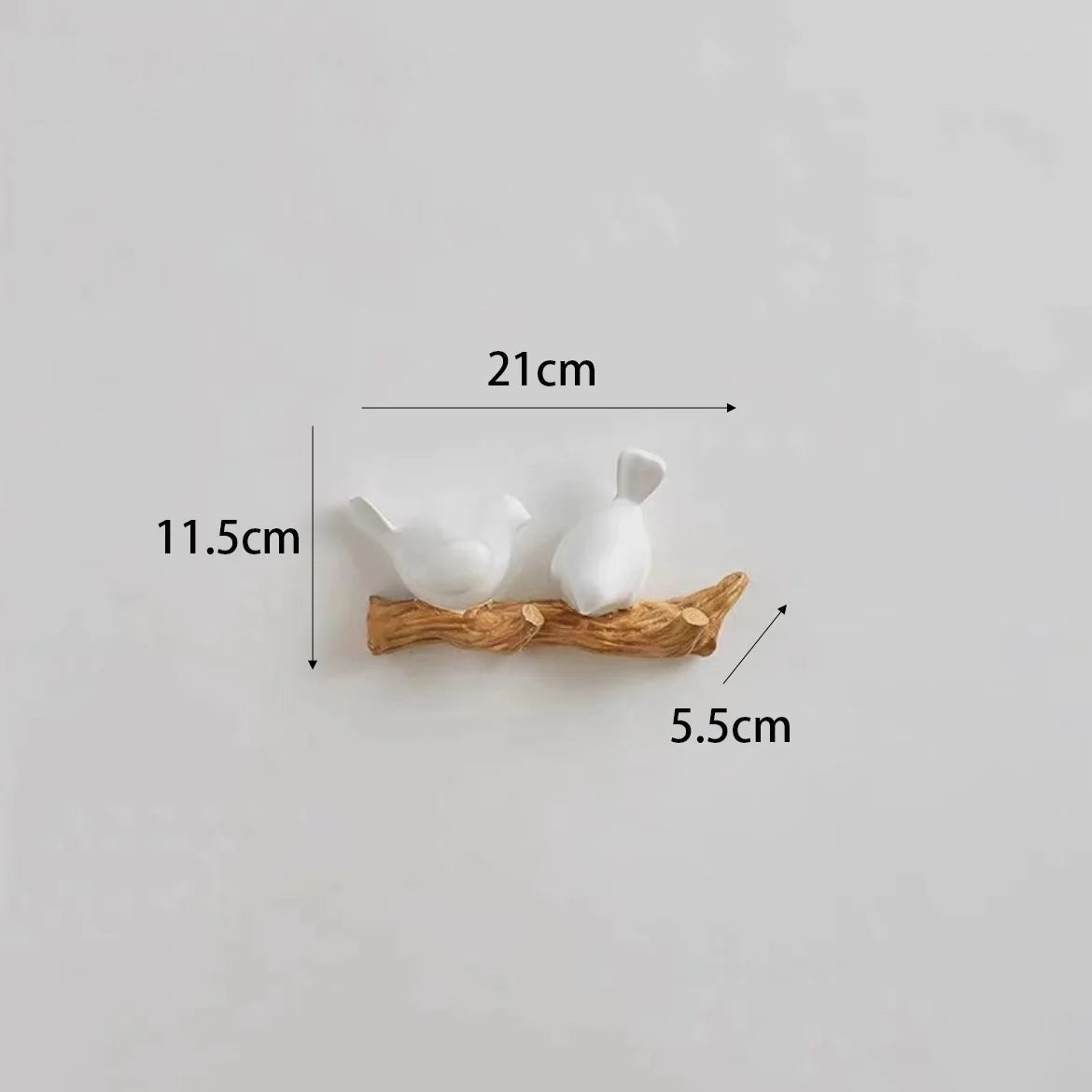 Measurement chart of two white birds on a branch with dimensions labeled.