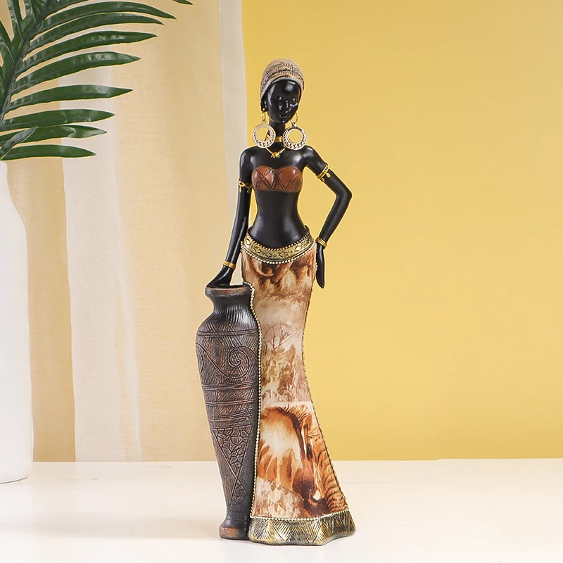 Decorative statue of a woman with intricate details against a yellow wall.